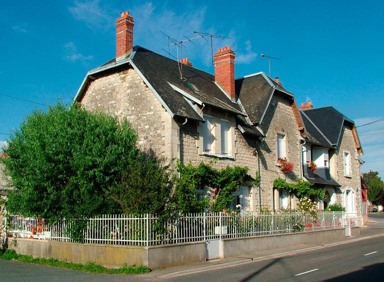 Maison à trois unités d'habitation