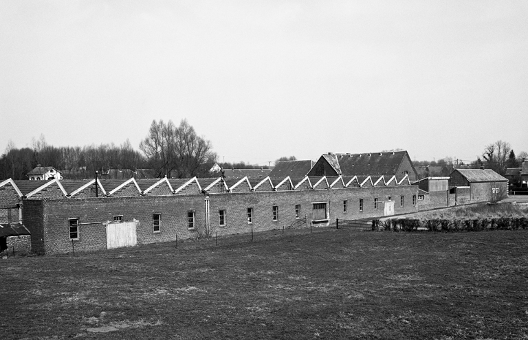 Ancienne filature de laine peignée Simon et Cie d'Esquéhéries, puis Carrissimo Fernand et Fils, puis Germ'Europe puis magasin industriel pour la confiturerie Materne de Boué